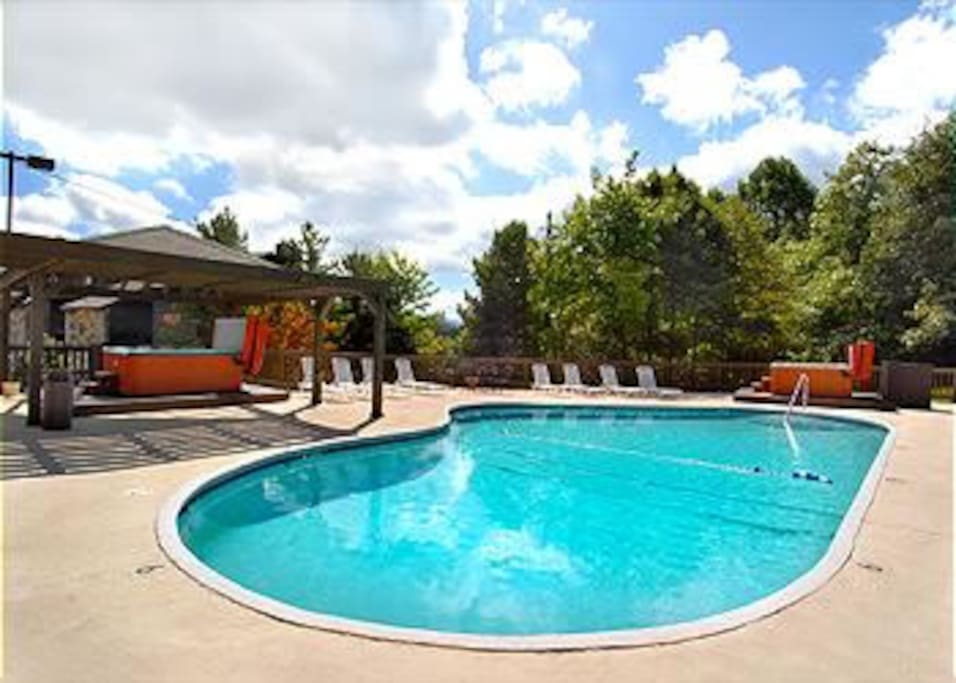 Large seasonal pool is located steps from the condo.