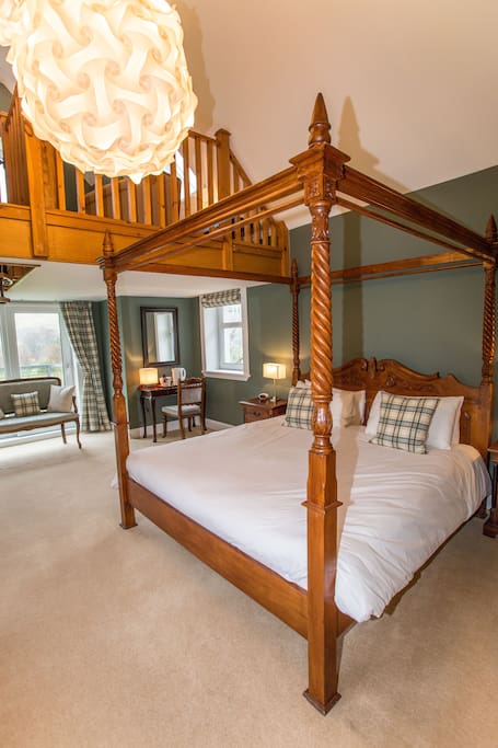 A sumptuous super-king four-poster bed