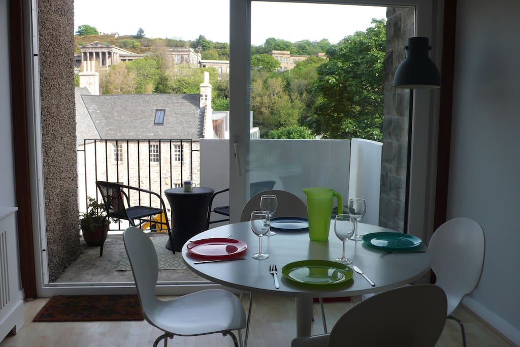 The dining area opens out to the private balcony with spectacular views of some of Edinburgh's most famous landmarks on Calton Hill