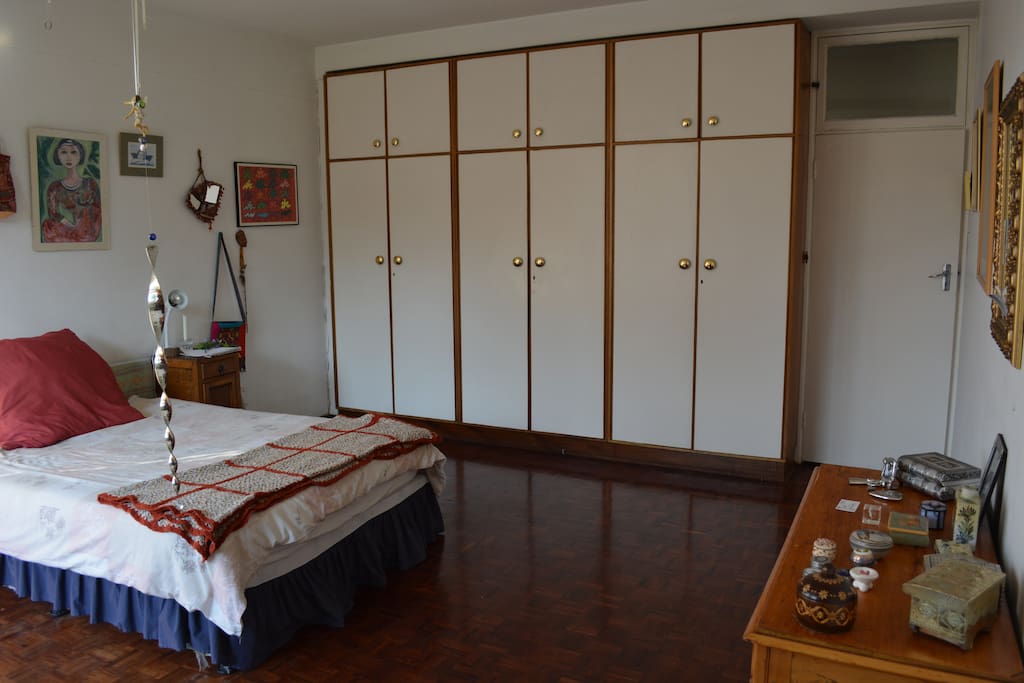 Sunny master bedroom in upscale neighborhood