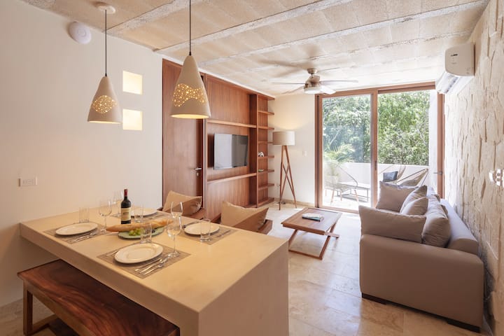 Living room and fully equipped kitchen. Enjoy your private terrace too. This apartment is perfect for couple.