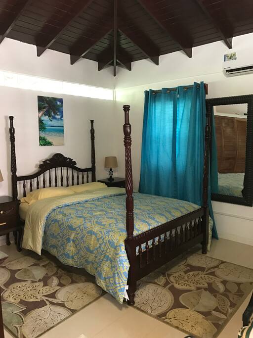 Comfortable bedroom with vaulted ceilings