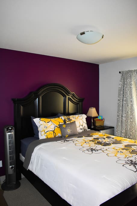 Relax on a plush queen bed and sleep in with room darkening curtains!
