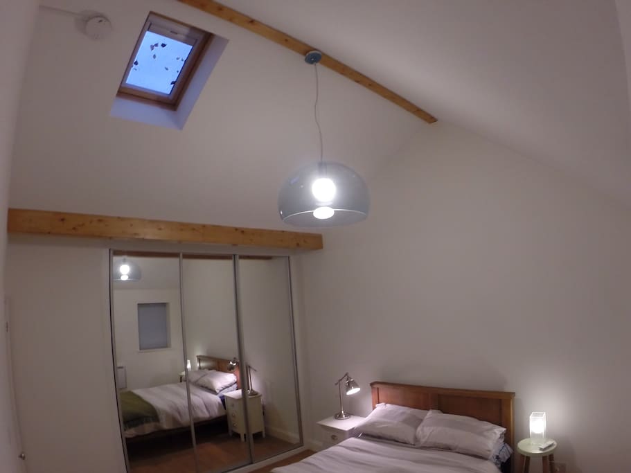 Double bedroom with remote controlled roof blind.