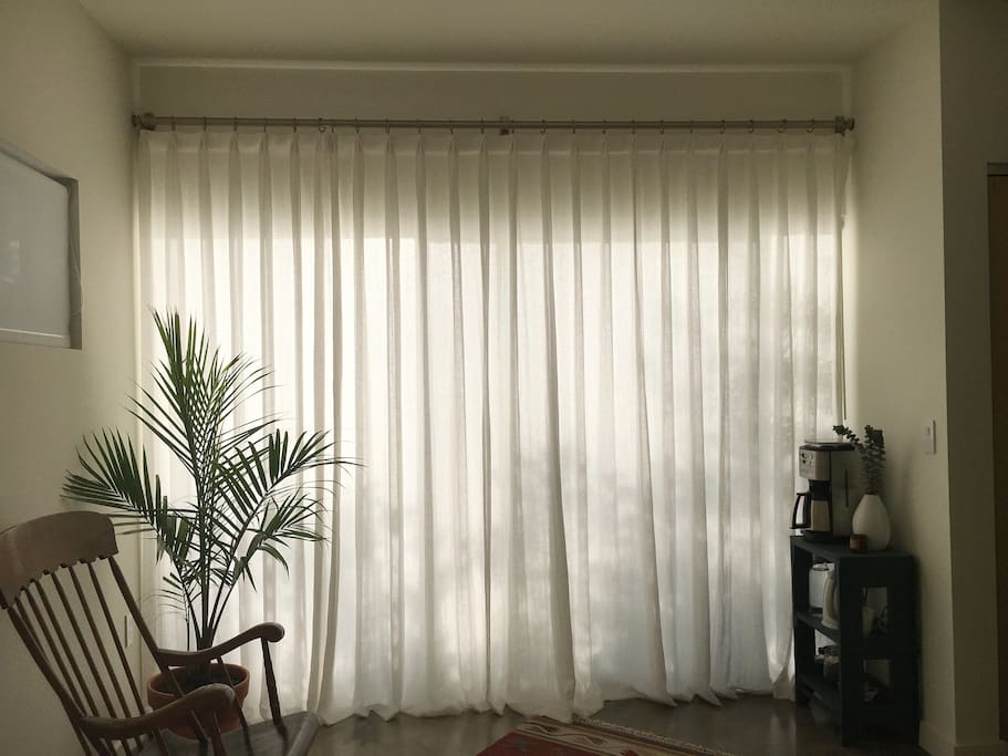 Large Sliding Glass Door That Leads to A Private Patio