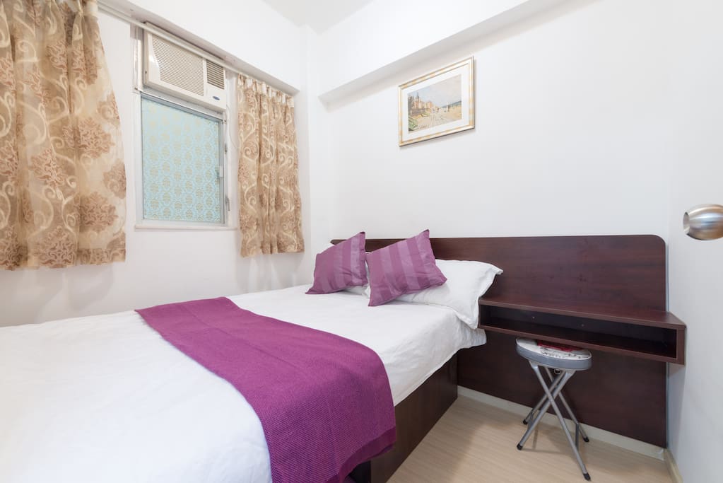 A double bed inside the bedroom