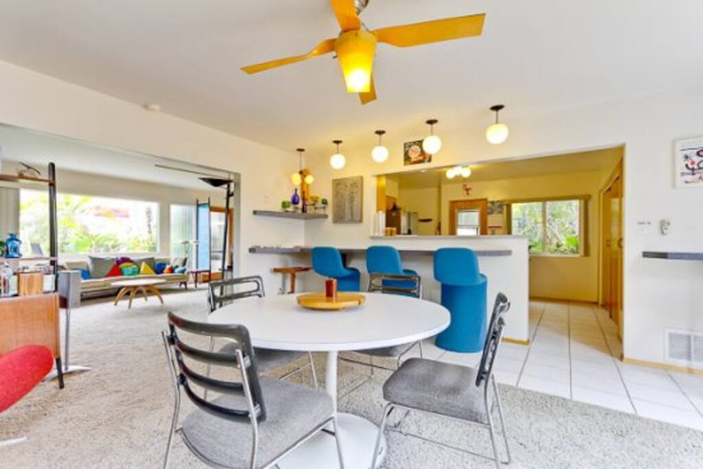 Dining area downstairs connected to kitchen and living room