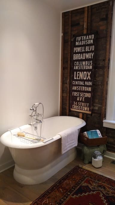 The large master bath with separate shower stall, also features an extra long, deep Randolph Morris tub for a relaxing soak. Epsom salts are always available for additional wellness benefits.