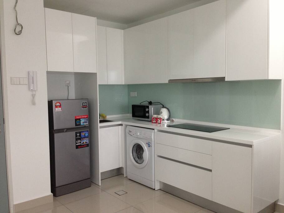 Kichen, fully equipped with refrigerator, microwave oven, kettle, cups, plates, bowls, light cooking utensils, forks and spoons. Washing machine is located in the kitchen and clothes dryer is in the small room.