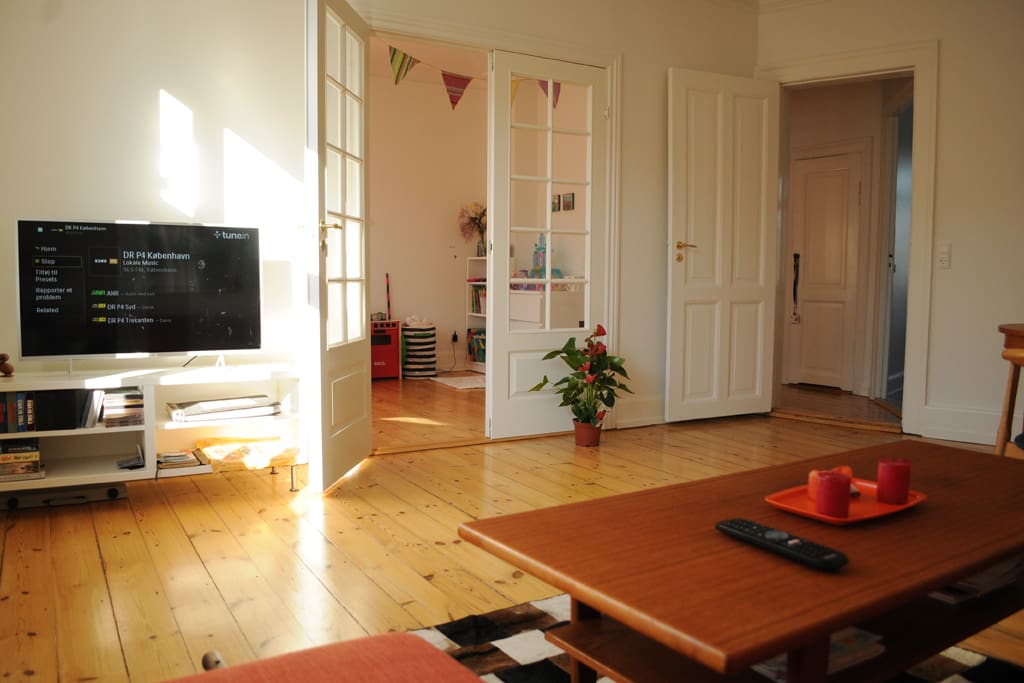 Living/dining room with French doors to 2nd bedroom. Smart TV w/Netflix
