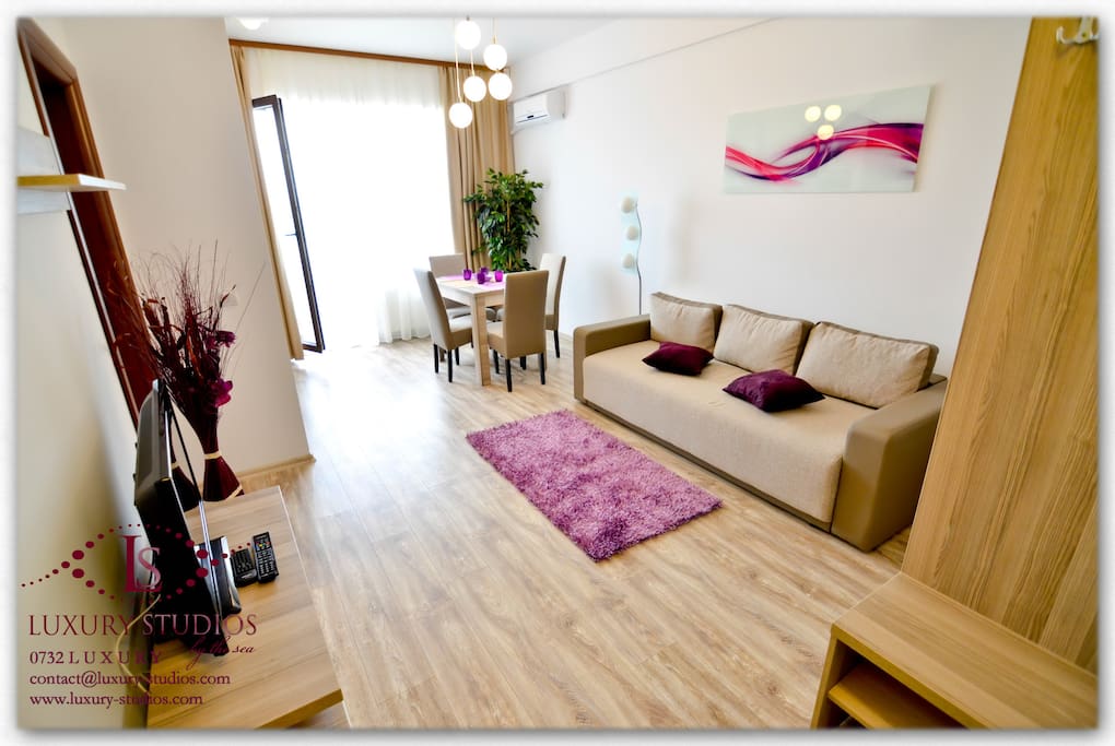 Living open space with air conditioning, finely furnished, extensible couch for 2 persons, table for 4 persons, modern decorations, plants, TV LCD, a large variety of TV channels, parental control for adult programmes, Sony PlayStation, collection of games and safe-deposit box. From the living you have access to a large terrace with a panoramic view.