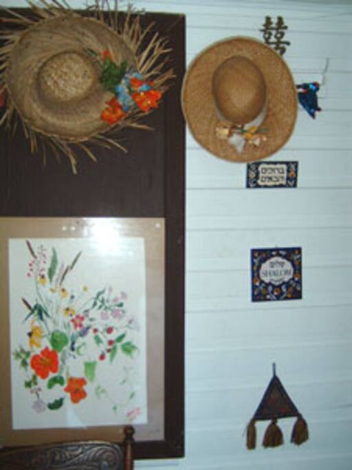 This is small vestibule in the entrance welcoming you in Hebrew and one of my old flower paintings smiles at you.