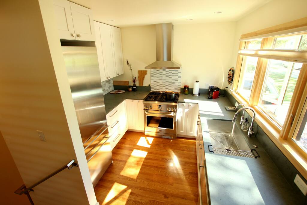 Cook's South Facing Kitchen with Vermont slate countertops, Monogram appliances, gas range, and an additional drinking/water reverse osmosis faucet. Fully stocked with cooking utensils, dishes, cookware, Nespresso espresso maker with separate milk frother and much more.