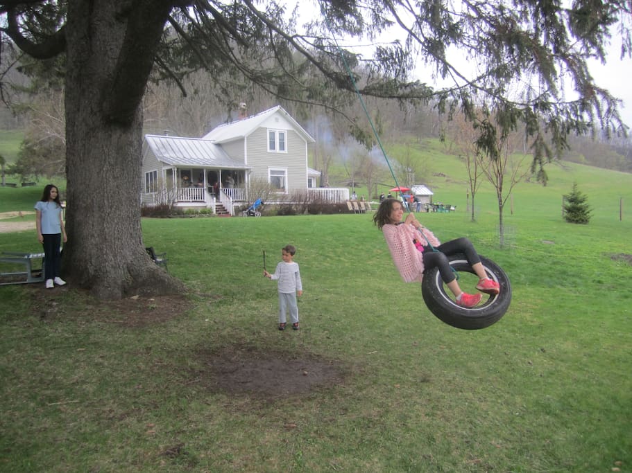 Kids love the large front lawn with its tire swing and fire pit for bonfires.