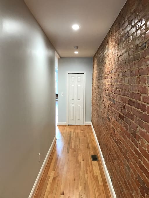 Exposed brick and hardwood floors throughout.