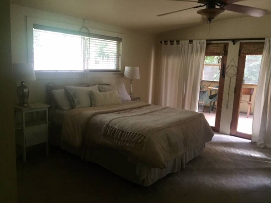 Large master bedroom with walkout screen porch.
