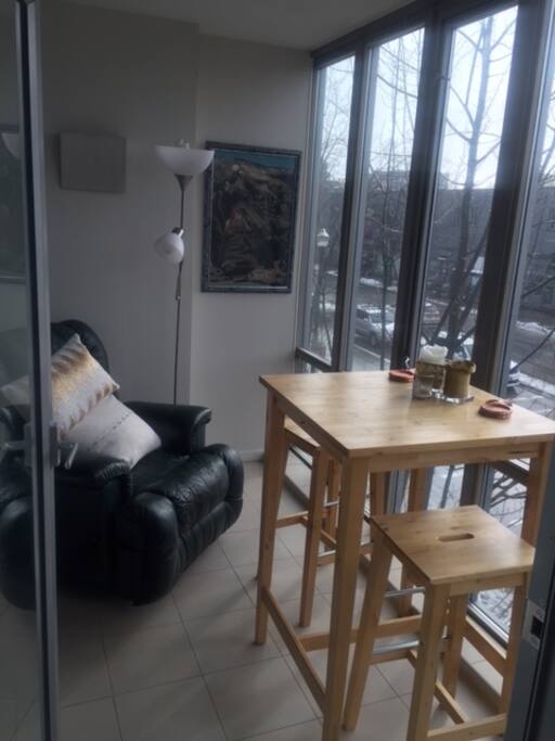 Sunroom. Perfect for people watching, reading a book or having a meal. Very comfortable.