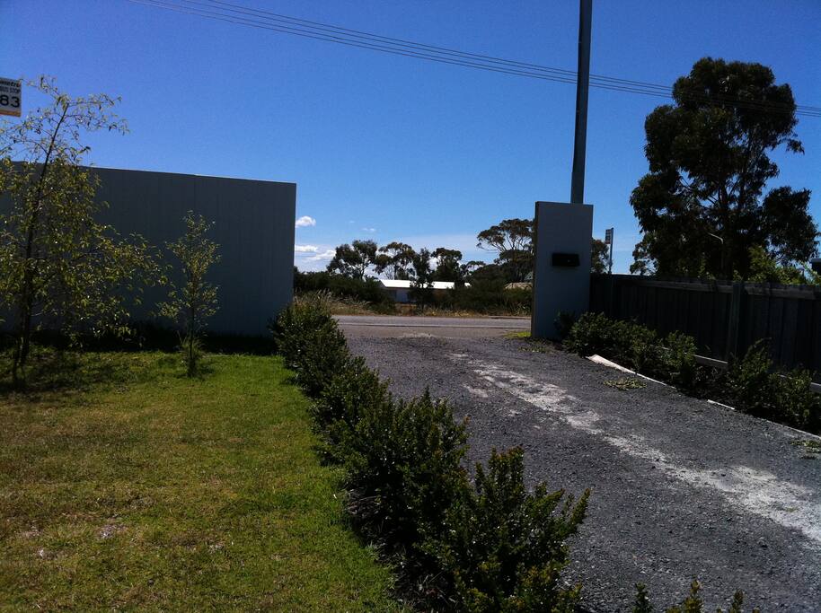 Entry to our property with secure electronic gate and fully fenced yards
