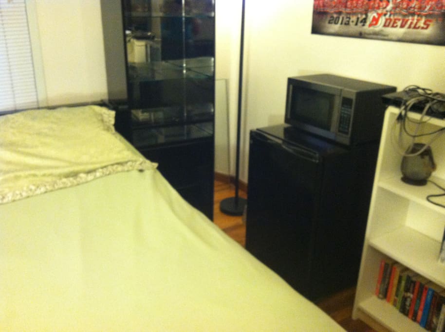 Right side of room. Mini-fridge and microwave. Closet.