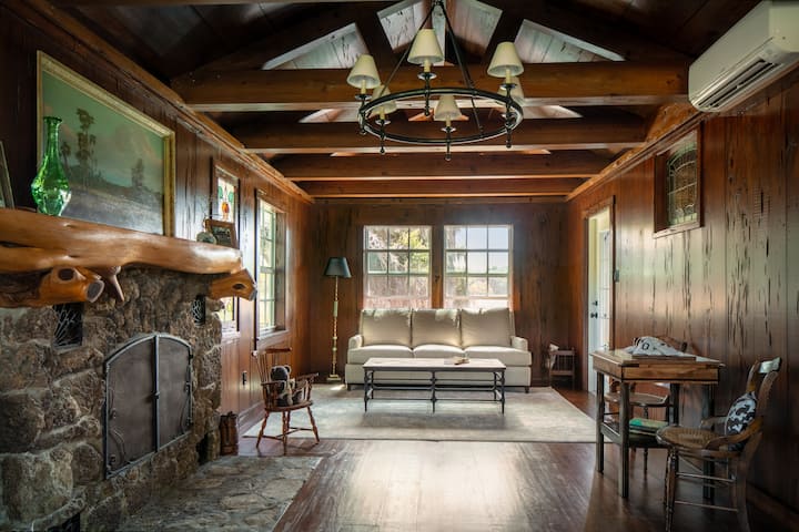 Living room with dining area and card table.