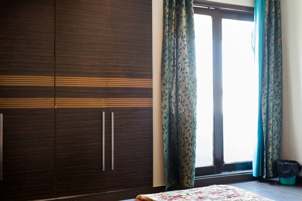Small balcony with natural light and closets.