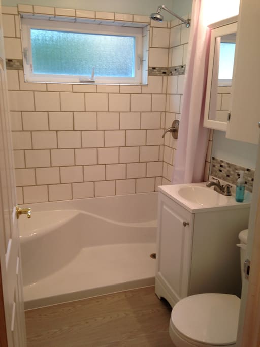Bath 1, adjacent to Bedroom 1 (but not en suite)