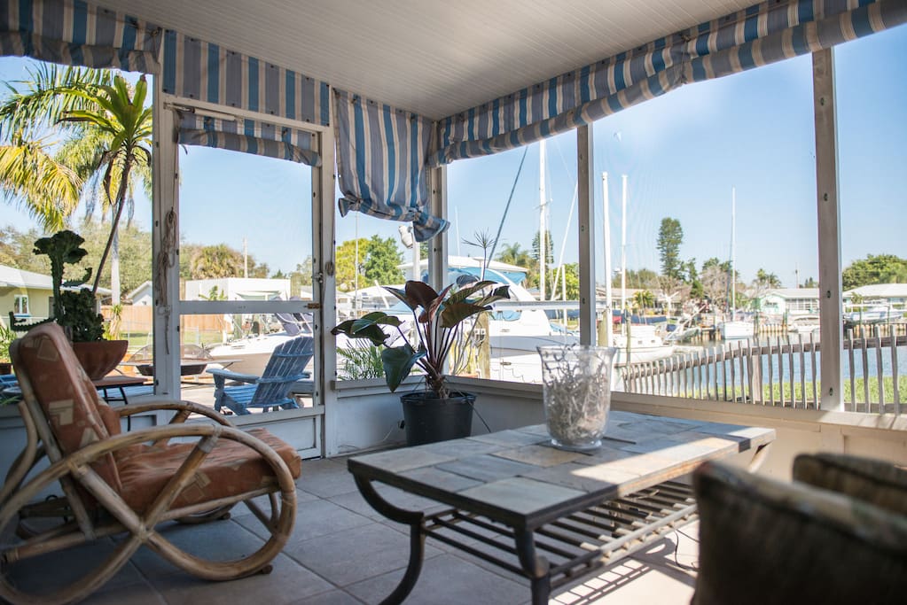 Screened in patio off of the lanai, with a great water view. There is a multi-slide 3-panel door between the lanai and this room. Open it wide open to let the outdoors in.