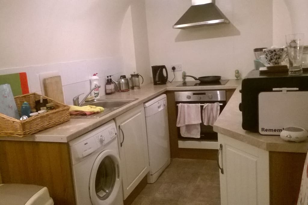 Fully equiped kitchen with dishwasher, washing machine, dryer and microwave, large fridge and freezer, cooker.