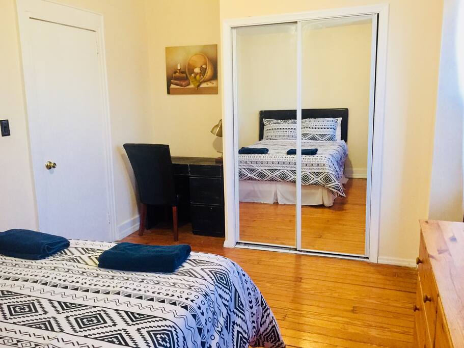The Spacious Master Bedroom sports a queen size bed, desk and full size mirrored closet