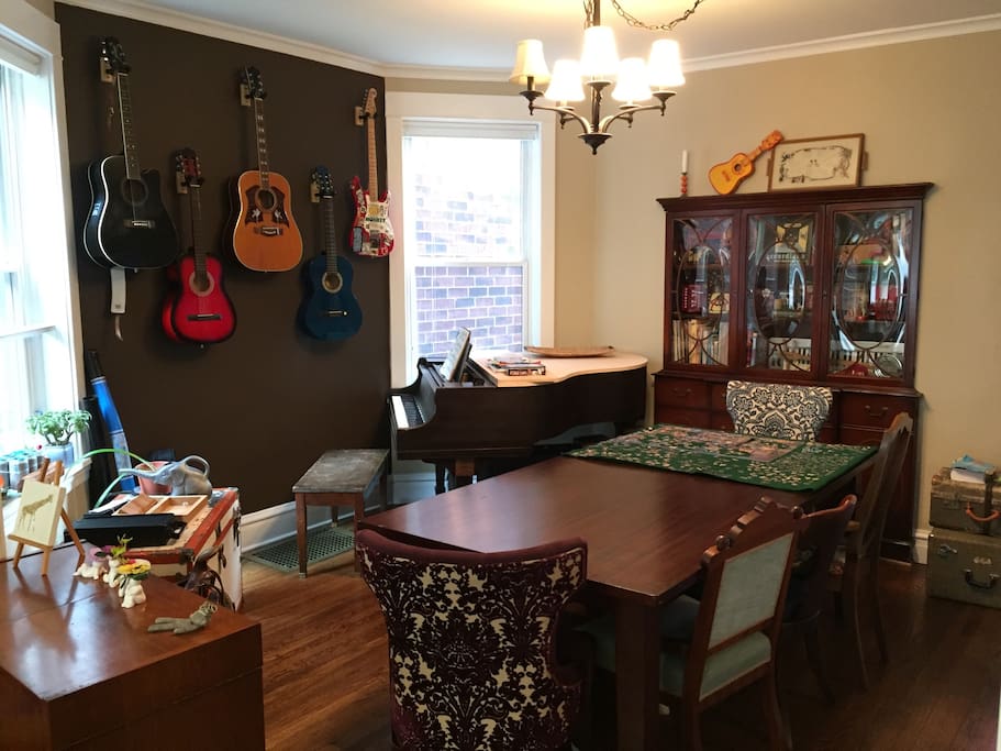 The music room- now with baby grand piano and dining room table.