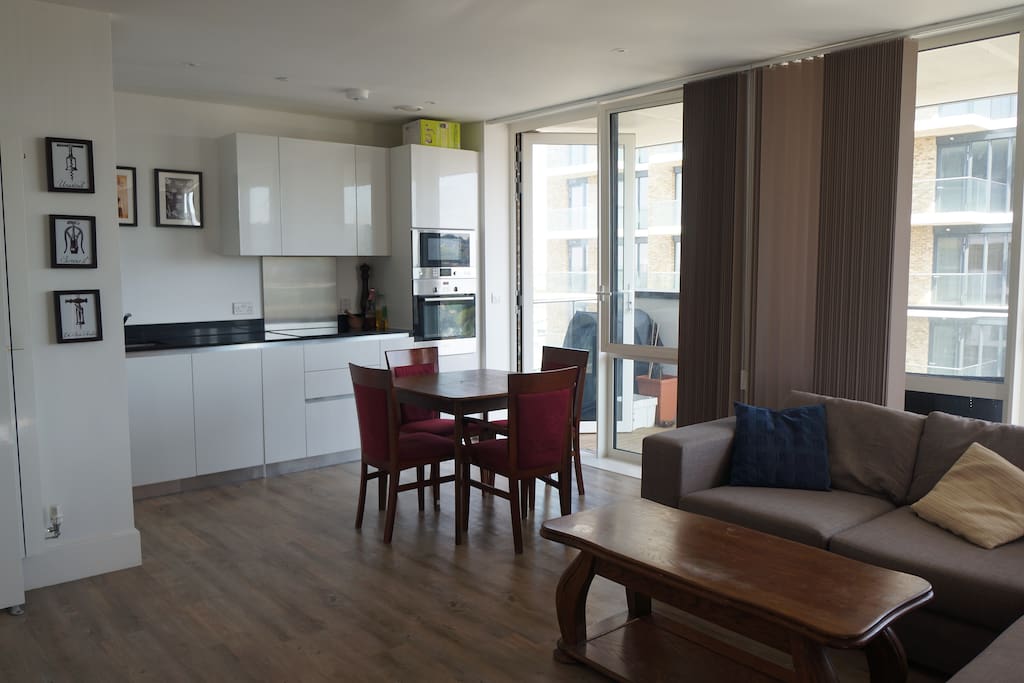 Living room and kitchen with access to balcony.
