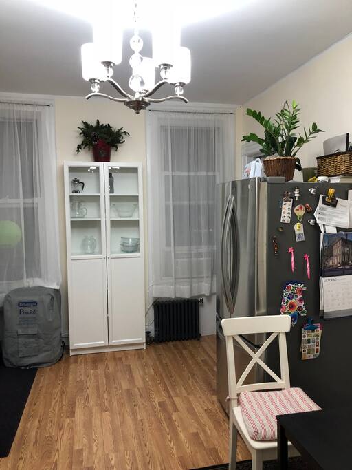 Kitchen. Your bedroom door is behind a fridge