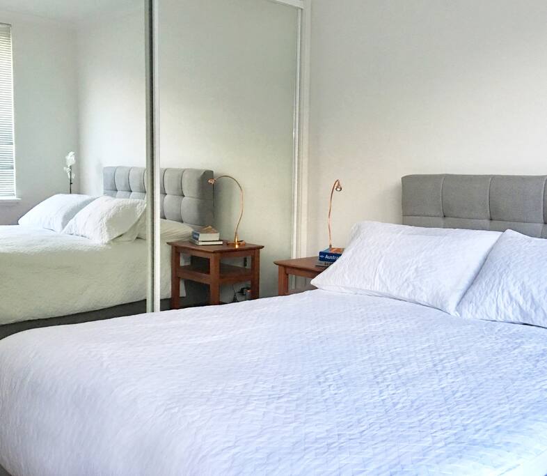 Bedroom 1. Big closet with mirror, plenty of space, nightstands and bedside lamp to read before sleep.