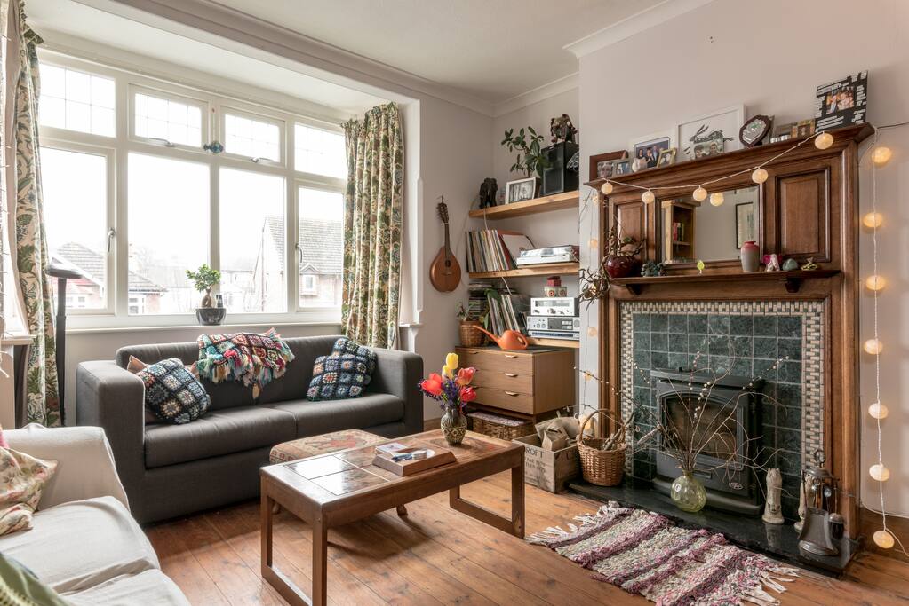 Comfy lounge with wood burning stove.