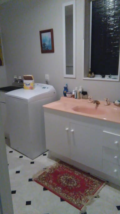 this is the bathroom with wash machine in it