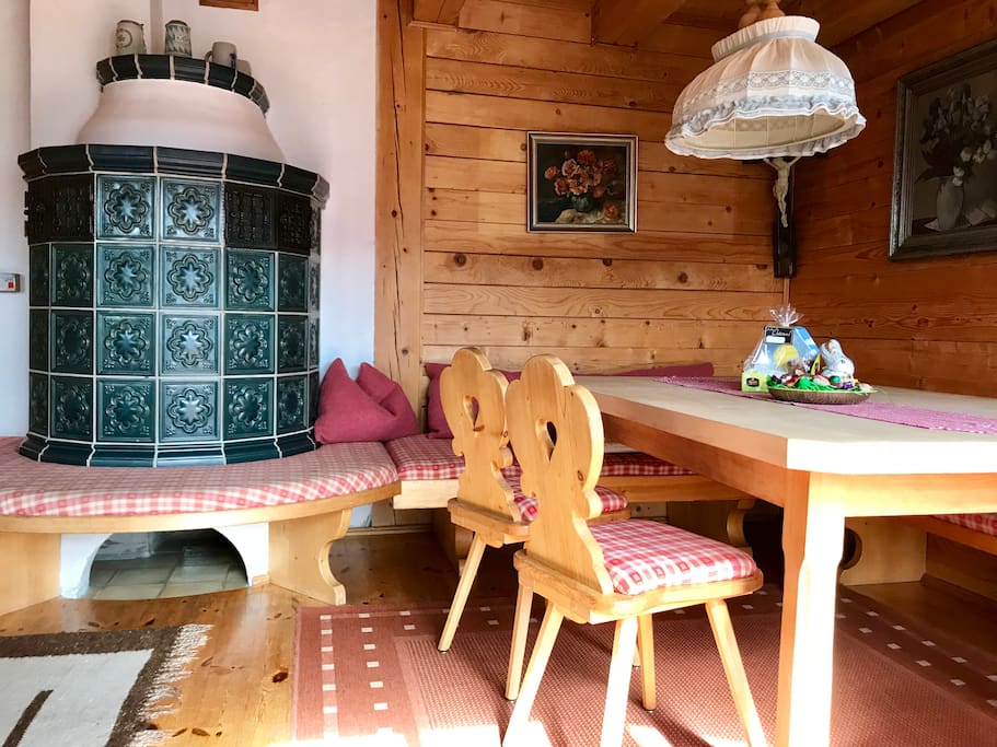 Tile stove / chimney / dining area
