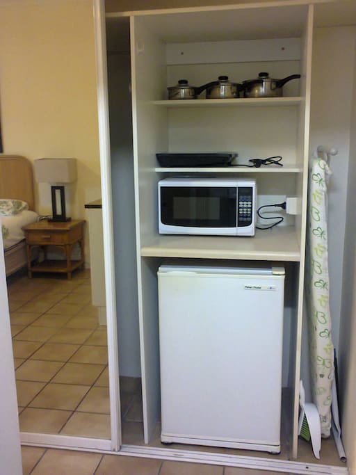 Microwave, Bar Fridge, Ironing Board. Induction Cooker