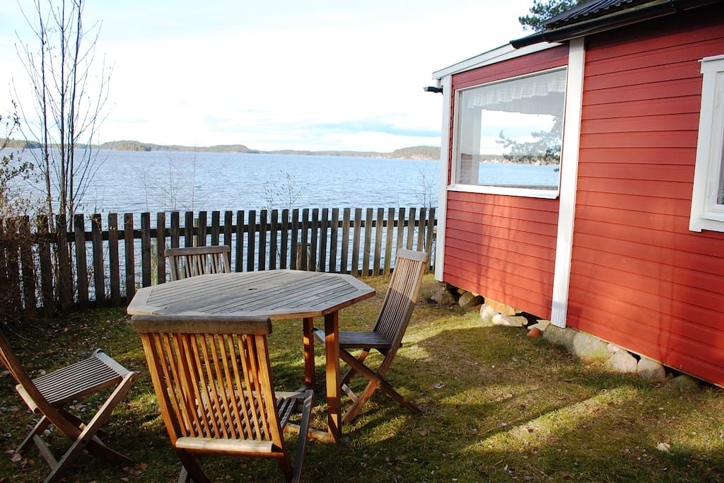 Little garden with terrace on one side of the cabin