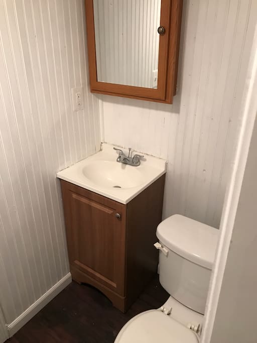 Clean bathroom with big shower.