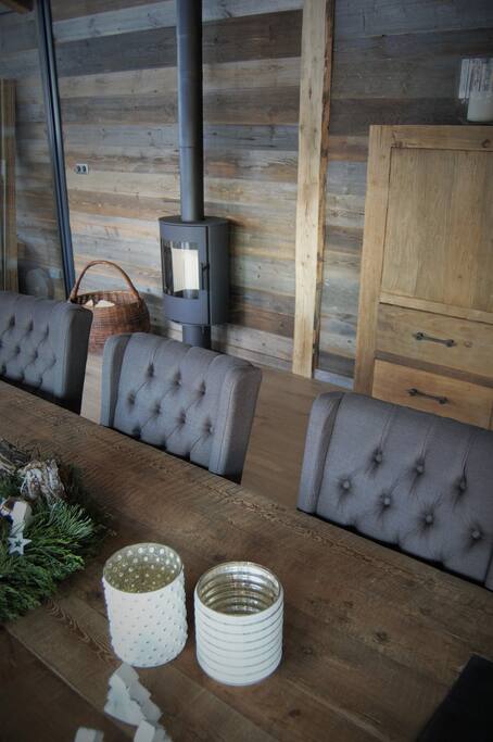 Upstairs dining with a small fireplace and cosy reading corner