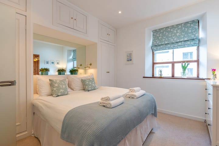 We have 3 lovely bedrooms, this is the en-suite master bedroom with plenty of storage & all linen and towels included 