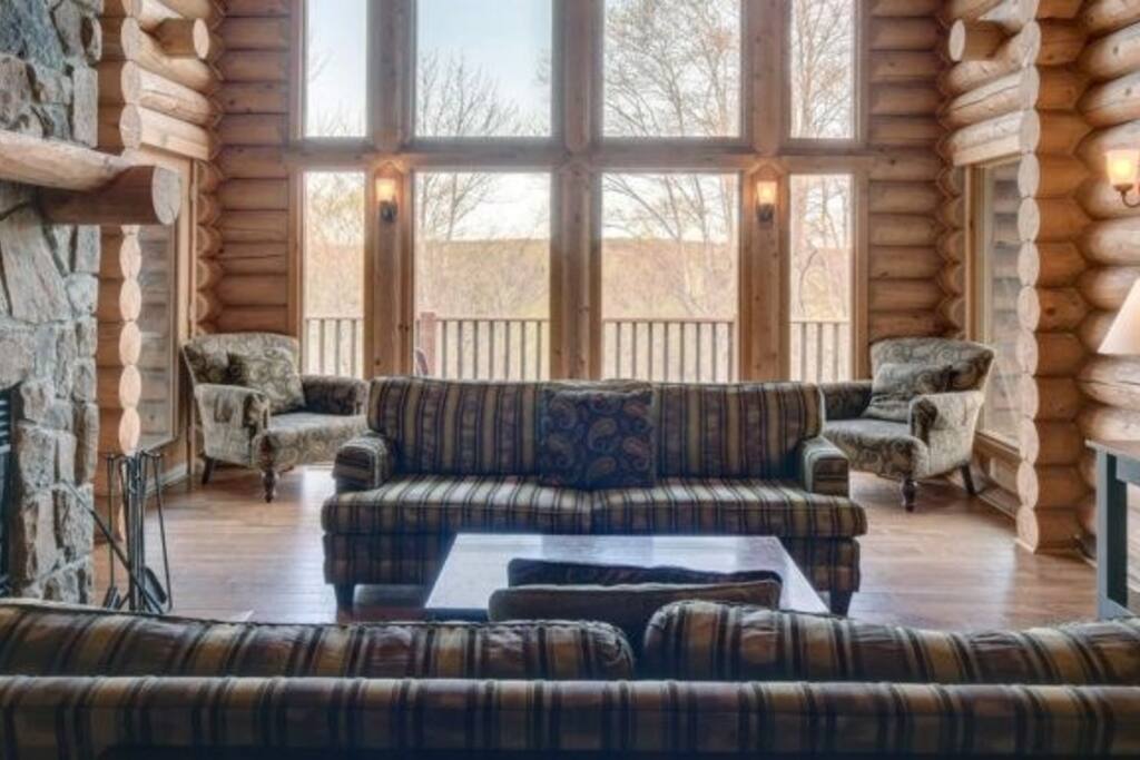 Relax and unwind in the spacious living area, complete with fireplace and flatscreen TV.