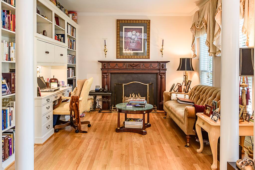 A combination library, living room and workstation is to the right of the open foyer.