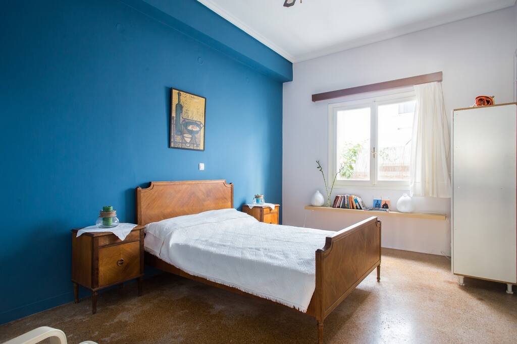 the sunny bedroom with view to the yard