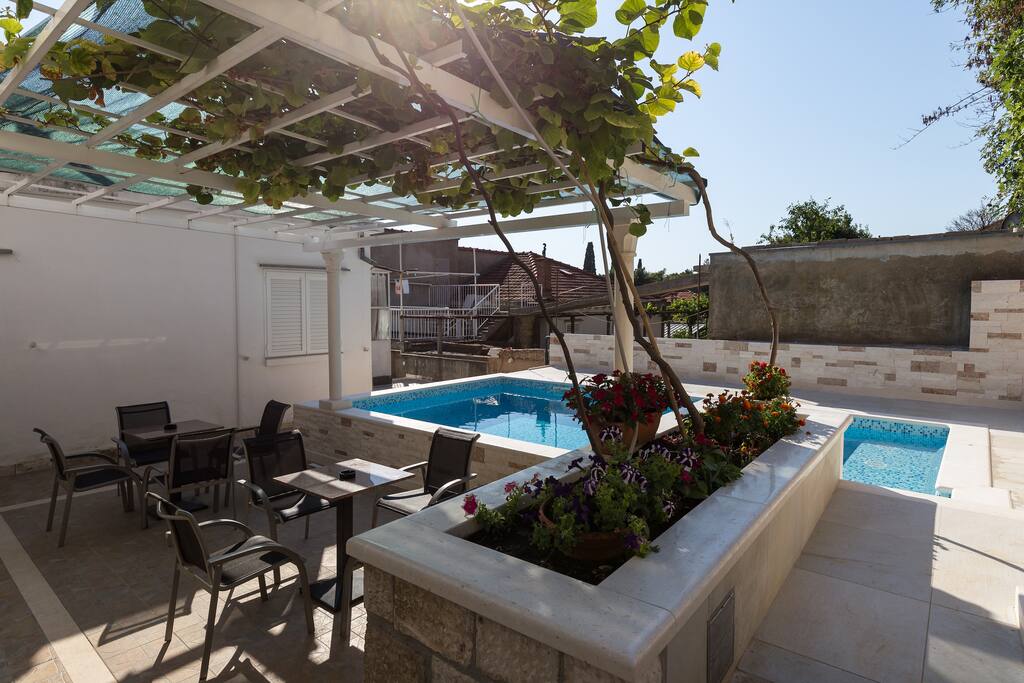 Terrace with seating area by the pool