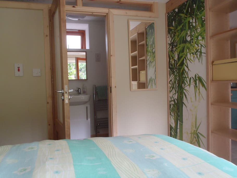 Bedroom with shower room beyond