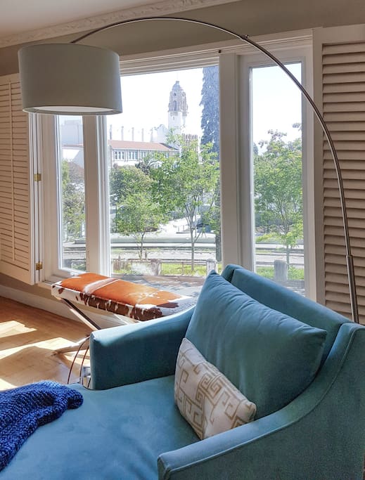 Relax with a view of the park out the window (Summer).