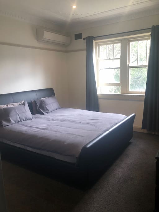 Large bedroom with kingsize bed and 50 inch tv.