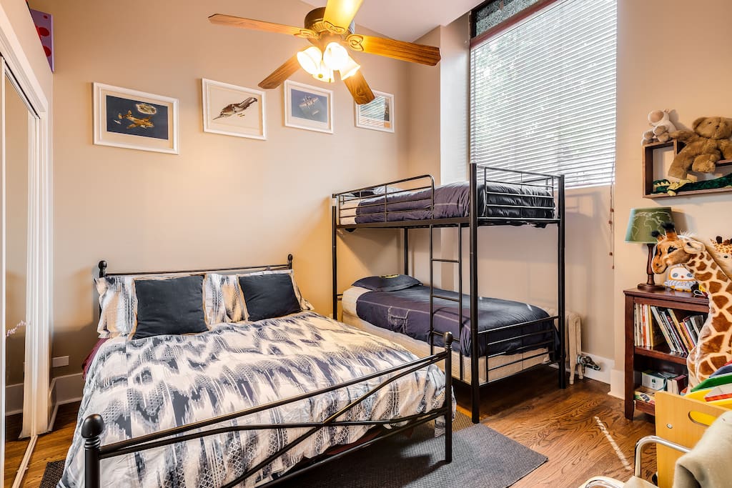 2nd bedroom with queen size bed and bunk beds, plus wall mounted television
