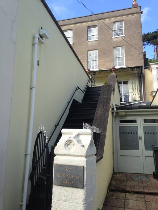 You get to the house up these steps that go up from Hill Road